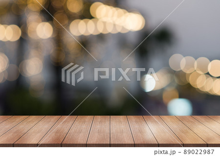Empty wooden table top with lights bokeh on blur restaurant background.	 89022987