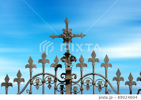 Wrought Iron Gate with a Religious Cross and Sharp Points 89024604