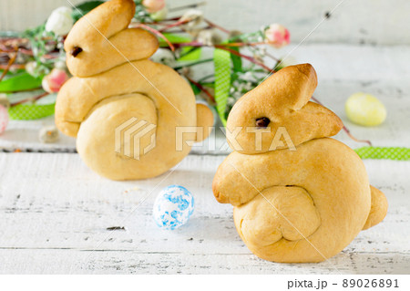 Baking Easter rabbits on a white wooden table Baking Easter rabbits on a white wooden table 89026891