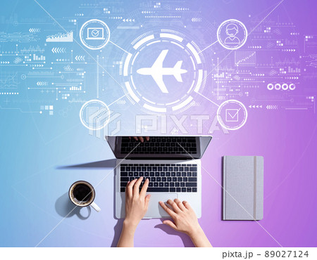 Flight ticket booking concept with person using a laptop Flight ticket booking concept with person using a laptop 89027124