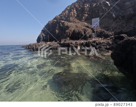 Incredible view from island to beach, small sandy beach on the island, coral reef, fujairah. High quality photo 89027343
