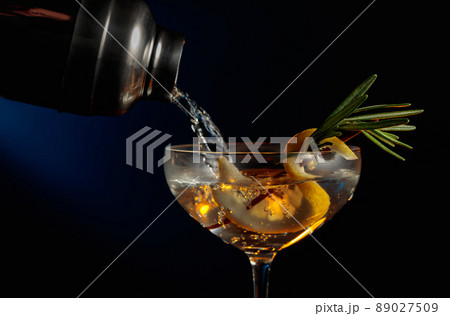 Gin tonic with rosemary and lemon. Gin tonic with rosemary and lemon. 89027509