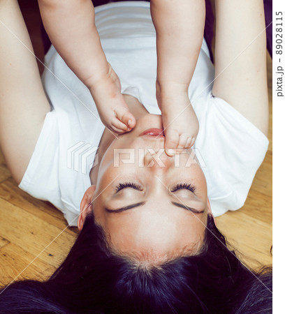 young brunette happy mother holding toddler baby son, breast-feeding concept, people lifestyle 89028115