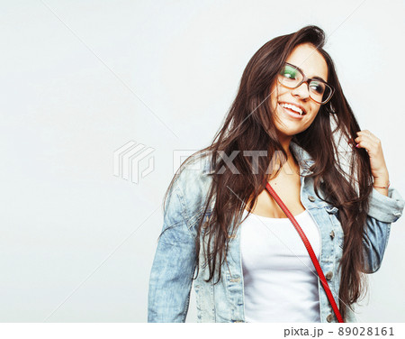 young happy smiling latin american teenage girl emotional posing isolated on white background, lifestyle people concept 89028161