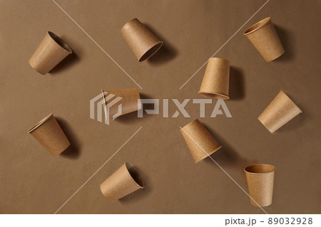 Eco friendly disposable tableware. Biodegradable craft dishes. Recycling concept. Also used in fast food, restaurants, takeaways, picnics. Close-up. Eco friendly disposable tableware. Biodegradable craft dishes. Recycling concept. Also used in fast food, restaurants, takeaways, picnics. Close-up. 89032928