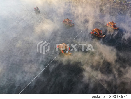 Aerial view of Sunrise with fog over Ban Rak thai, chinese village near a lake in Mae Hong Son 89033674