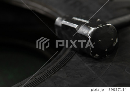 Tire wheel crossfit sledgehammer black workout athlete heavy equipment, for effort cross in young for strength muscular, sportswear flipping. Male indoors flip, bodybuilder 89037114
