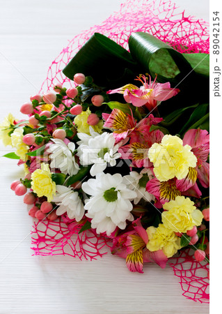 Beautiful bouquet of colorful flowers, white chrysanthemums and yellow carnation. Beautiful bouquet of colorful flowers, white chrysanthemums and yellow carnation. 89042154