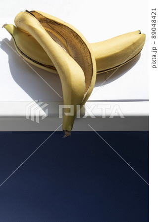 Banana skin on a white windowsill. Banana skin on a white windowsill. 89048421