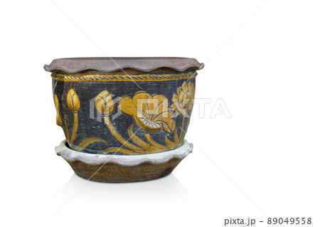 old brown and orange ceramic pot on ceramic saucer, on white background, object, vintage, retro, ancient, copy space 89049558