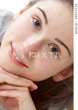 Fitness Workout. Sporty Woman Doing Bicycle Crunch Abs Exercise Lying On Floor Over Pink And Blue Neon Studio Background. Determined Lady Wearing White Fitwear Training Flexing Abdominal Muscles 89053328