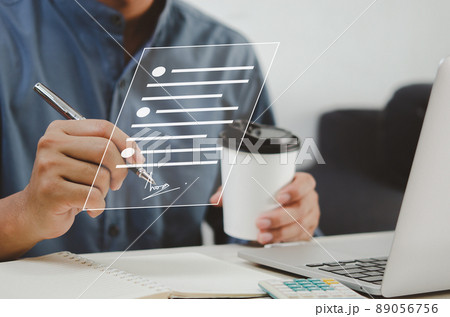 businessman holding pen business digital signing documents on virtual screen. 89056756