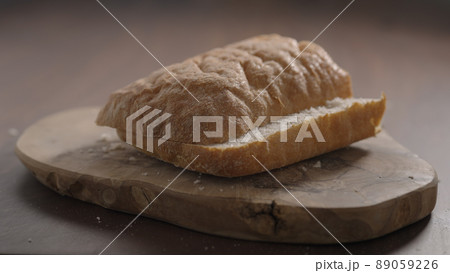 sliced in halves ciabatta fall on olive wood board sliced in halves ciabatta fall on olive wood board 89059226