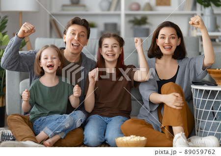 Mother, father and daughters spending time together. 89059762