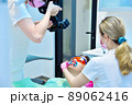 Dentist photographing teeth before teeth whitening procedure. 89062416