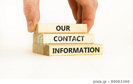 Our contact information symbol. Concept words Our contact information on wooden blocks. Businessman hand. Beautiful white table white background. Business our contact information concept. Copy space. 89063366