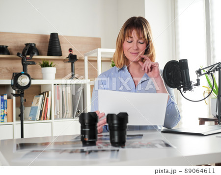Female photographer working at office studio Female photographer working at office studio 89064611