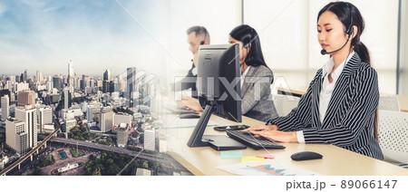 Business people wearing headset working in office broaden view 89066147