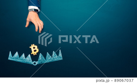 Trapped concept. Bitcoin as a bait. cryptocurrency into the bear trap. Businessman hand trying to Trapped concept. Bitcoin as a bait. cryptocurrency into the bear trap. Businessman hand trying to 89067037