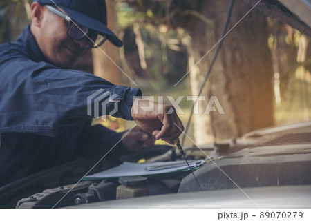 Mechanic car service auto garage in automotive mobile center. Technician workshop repair engine motor vehicles service mechanical engineering business. Automobile mechanic hands car repairs technic Mechanic car service auto garage in automotive mobile center. Technician workshop repair engine motor vehicles service mechanical engineering business. Automobile mechanic hands car repairs technic 89070279