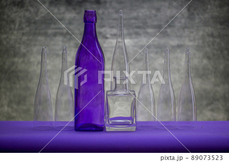 Still life with glassware on a purple table Still life with glassware on a purple table 89073523
