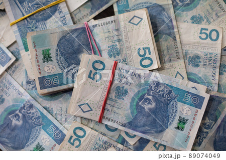 Close-up view of a file of fifty-zloty banknotes. Polish national currency. 89074049