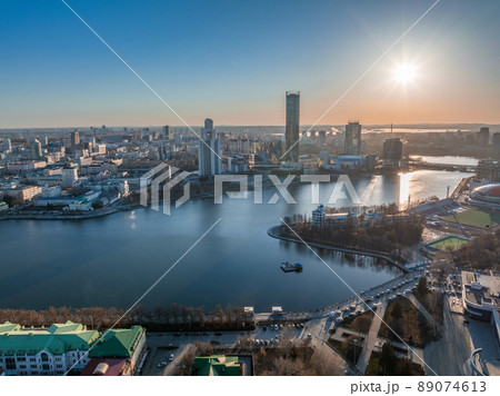 Yekaterinburg city and pond aerial panoramic view at early spring or autumn in clear sunset. 89074613
