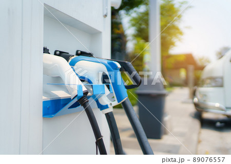 Photograph of the modern electric vehicle charging station or EV quick charging station for battery electric vehicle and plug-in hybrid electric vehicle. 89076557