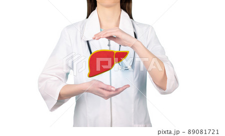 Image of a doctor in a white coat and liver above his hands. Concept of healthy liver and donation. Image of a doctor in a white coat and liver above his hands. Concept of healthy liver and donation. 89081721