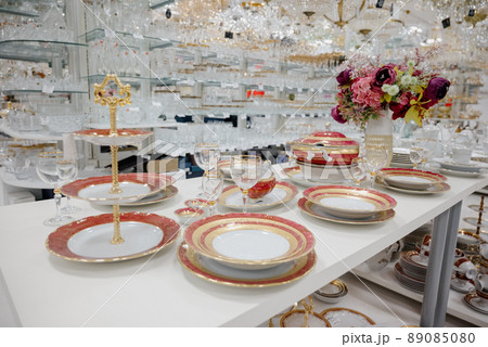 Set of fresh white dishes on a wooden table, indoors 89085080