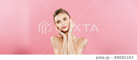 Beauty Concept - Beautiful Caucasian woman with clean skin, natural make-up isolated on bright pink background with copy space. 89085163