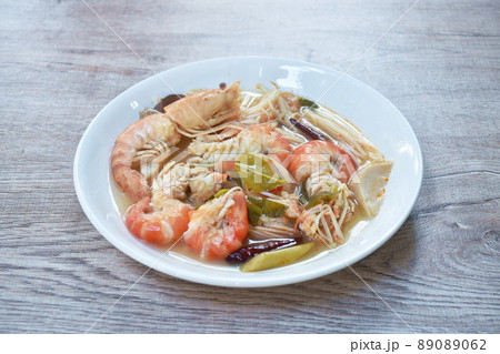boiled river shrimp with herb in Thai spicy soup or tom yum kung on plate boiled river shrimp with herb in Thai spicy soup or tom yum kung on plate 89089062