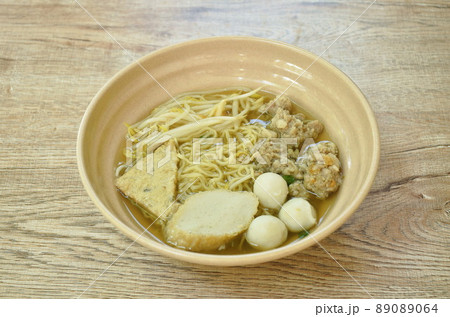 egg yellow noodles topping chop boiled pork and fish ball in soup on bowl egg yellow noodles topping chop boiled pork and fish ball in soup on bowl 89089064