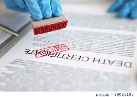 Pathologist putting red omicron stamp on death certificate Pathologist putting red omicron stamp on death certificate 89091195