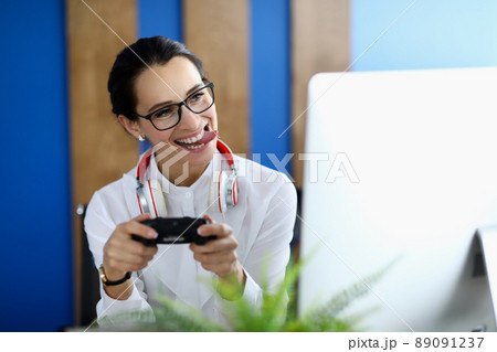Joyful woman having fun with game console 89091237