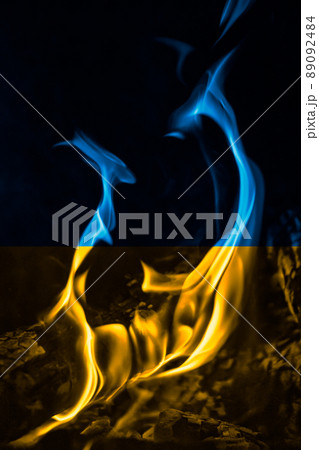Ukrainian national flag colors with fire, war concept 89092484