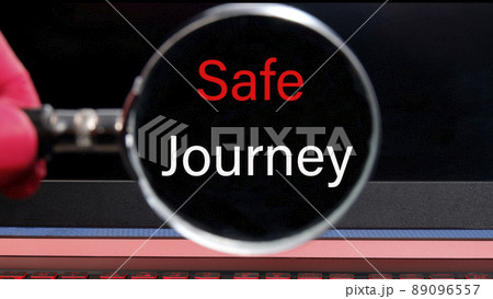 text Safe journey found with a magnifying glass on a black laptop monitor. Concept photo 89096557
