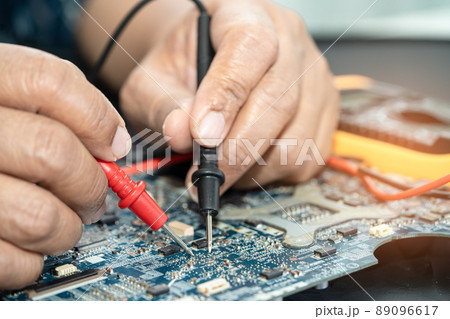 Technician repairing inside of mobile phone. Integrated Circuit. the concept of data, hardware, technology. Technician repairing inside of mobile phone. Integrated Circuit. the concept of data, hardware, technology. 89096617