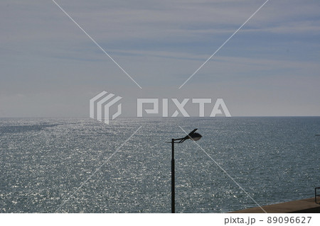Lamppost on a bright day by the sea Lamppost on a bright day by the sea 89096627