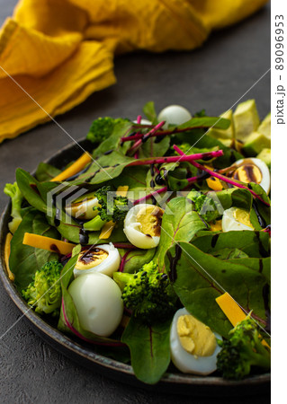 Salad with quail eggs, avocado and cheese 89096953
