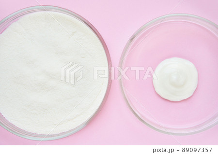Collagen white powder. Pastel color background. Health product. Woman cosmetics Collagen white powder. Pastel color background. Health product. Woman cosmetics 89097357