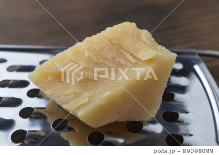Close-up of a piece of parmesan 89098099
