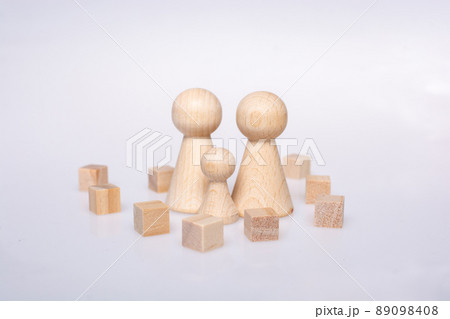Woodencubes and  figurines of people as family concept 89098408