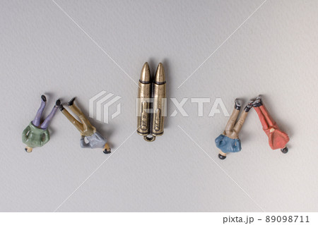 Men figurine model and Bullet as Conceptual against the war 89098711