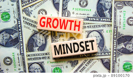 Growth mindset symbol. Wooden blocks with concept words Growth mindset on beautiful background from dollar bills. Business growth mindset concept. Copy space. Growth mindset symbol. Wooden blocks with concept words Growth mindset on beautiful background from dollar bills. Business growth mindset concept. Copy space. 89100170