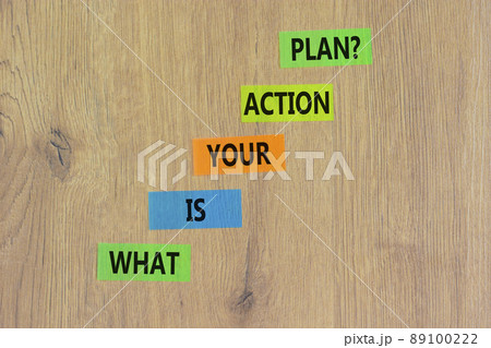 Action plan symbol. Concept words What is your action plan on colored paper. Beautiful wooden table wooden background. Business What is your action plan concept. Copy space. 89100222