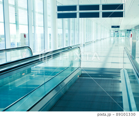 airport interior with moving stairway, picture taken at Munich Airport airport interior with moving stairway, picture taken at Munich Airport 89101330