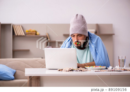 Young sick man suffering at home 89109156