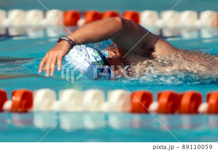 Male professional swimmer competitor in swimming pool Male professional swimmer competitor in swimming pool 89110059