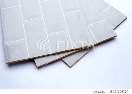 Pile of wall tiles on white background. Pile of wall tiles on white background. 89110314